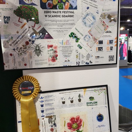 Board with examples of printing on plantable paper and a RemaDays award